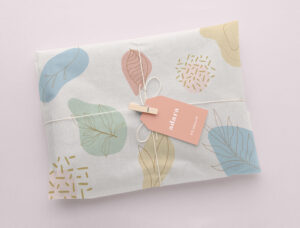 adara branded package with pastel wrapping paper, thank-you cards, and a decorative ribbon.