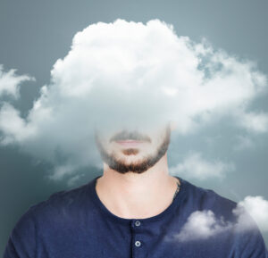 Young man with a clouded mind symbolizing mental challenges before therapy.