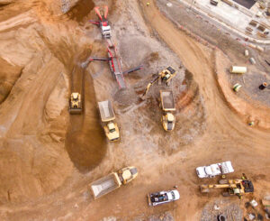 Aerial photo of construction site with multiple excavators.