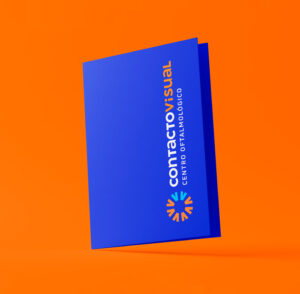 Navy blue Contacto Visual folder with logo on an orange background.