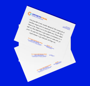 Three Contacto Visual prescription sheets placed on a blue background.