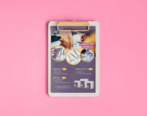 Flyer for suture sets from Midwifery Wisdom Collective, on a clipboard with a pink background.