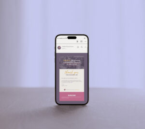 Mobile phone showing a newsletter from Midwifery Wisdom Collective, placed on a lilac background.