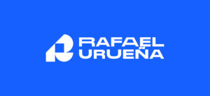 White Rafael Urueña logo on a solid blue background.