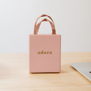 Small pink box with adara logo and premium pink ribbon handle.