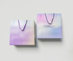 candle brand identity Two premium paper bags from Virtuosity Senses, placed on a light background for an elegant branding presentation.