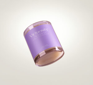 Glass candle with a purple label from Virtuosity Senses, designed for a premium self-care experience.