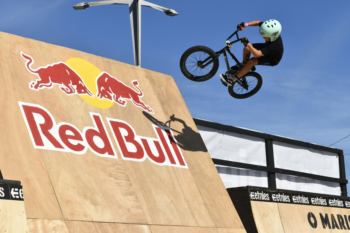 define your brand’s personality A cyclist mid-air over a Red Bull-branded ramp, symbolizing the brand’s bold and energetic identity.