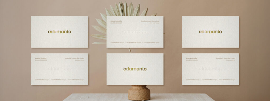 Six adamanto business cards arranged in two rows showing both front and back.