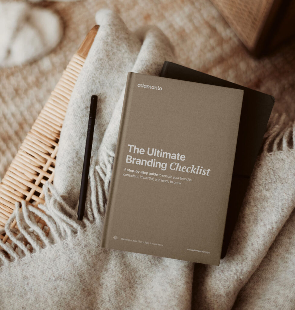 Closed copy of The Ultimate Branding Checklist with almond cover on beige blanket and chair.