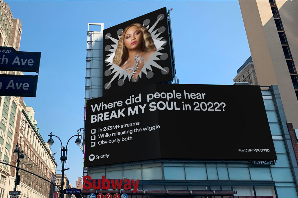 Spotify Wrapped 2022 billboard with Beyoncé in NYC showing bold brand voice tone through playful messaging.
