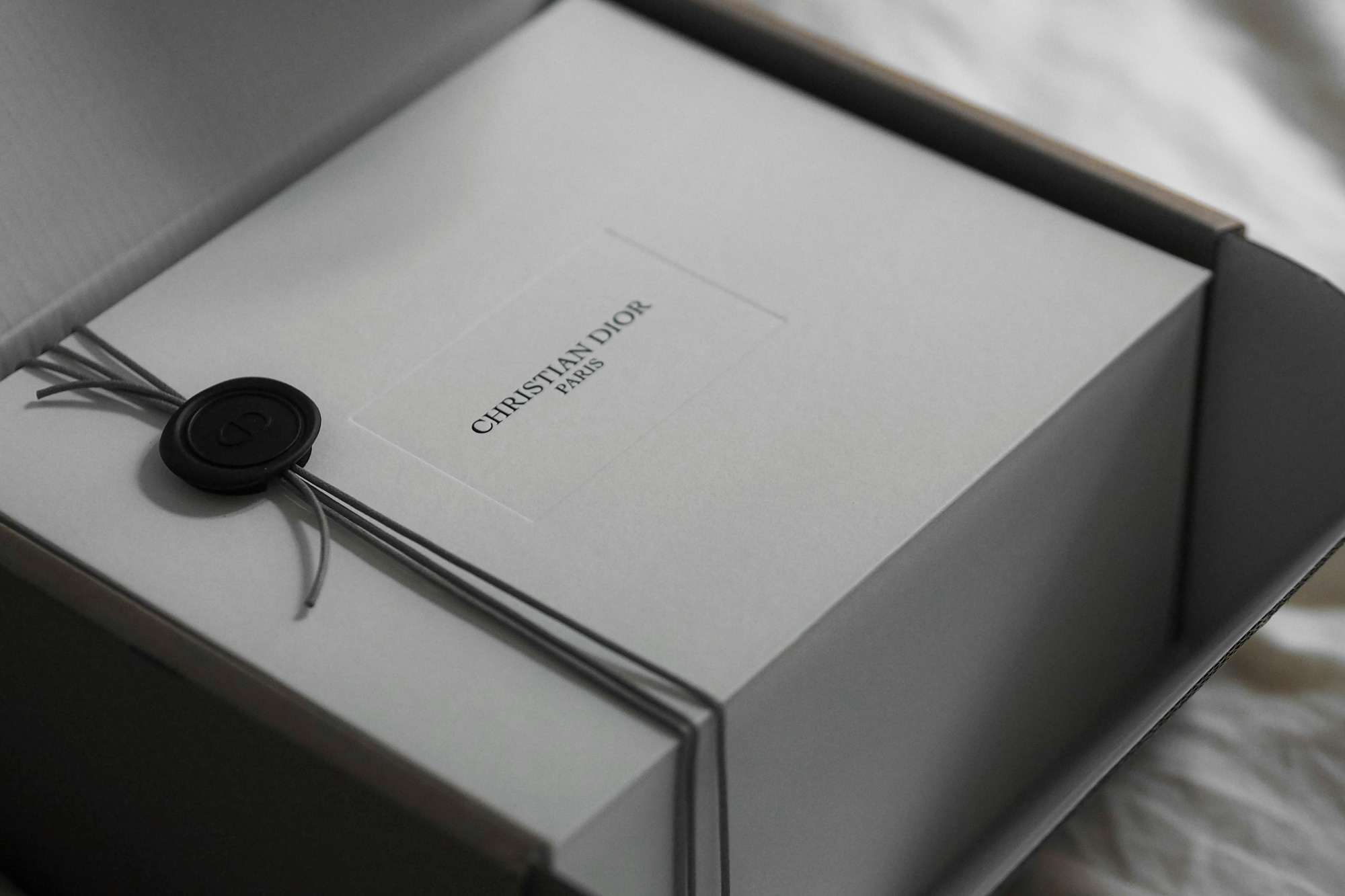 Luxury Christian Dior packaging with minimalist branding—example for the question should I use my name for my business.