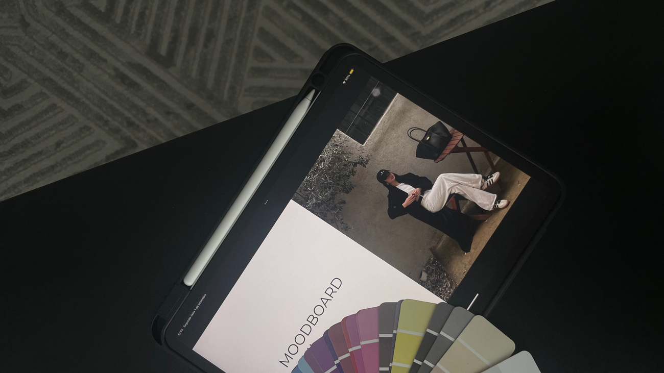 Tablet showing a moodboard with color swatches illustrating do I need a rebrand decision process