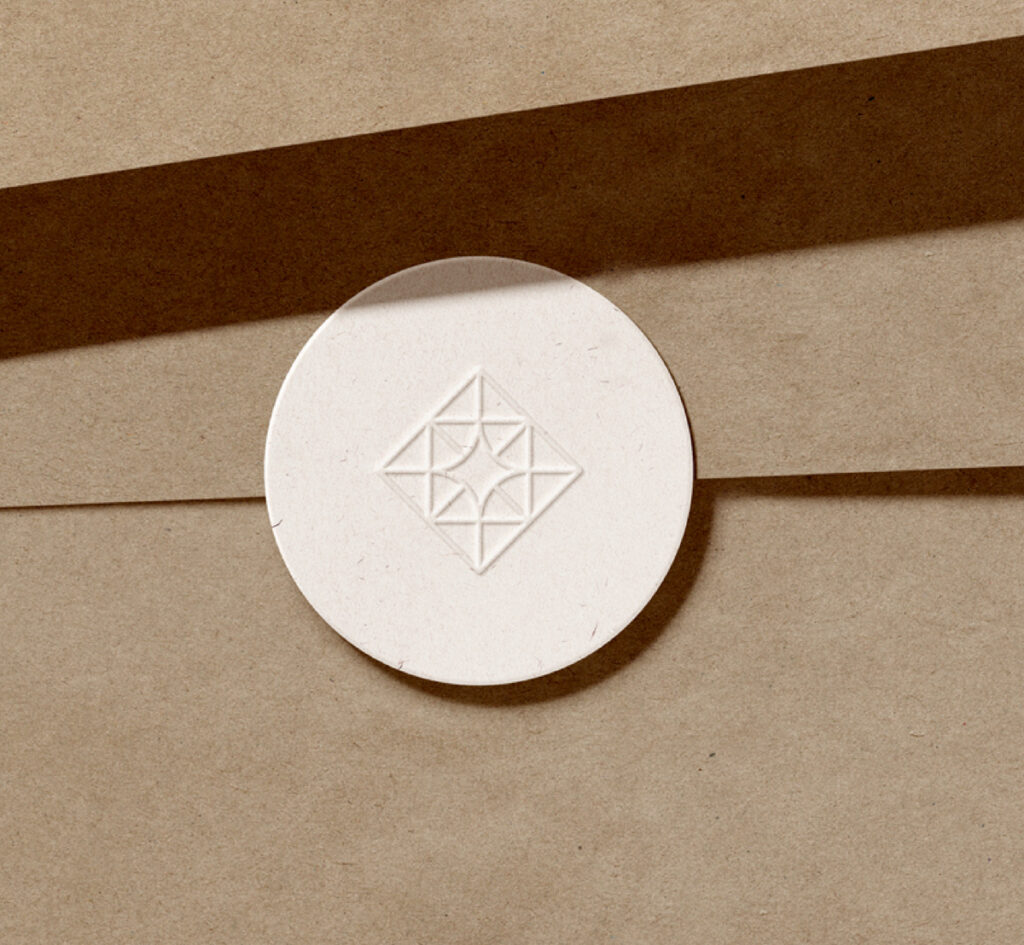 Embossed diamond symbol from the visual identity of adamanto.